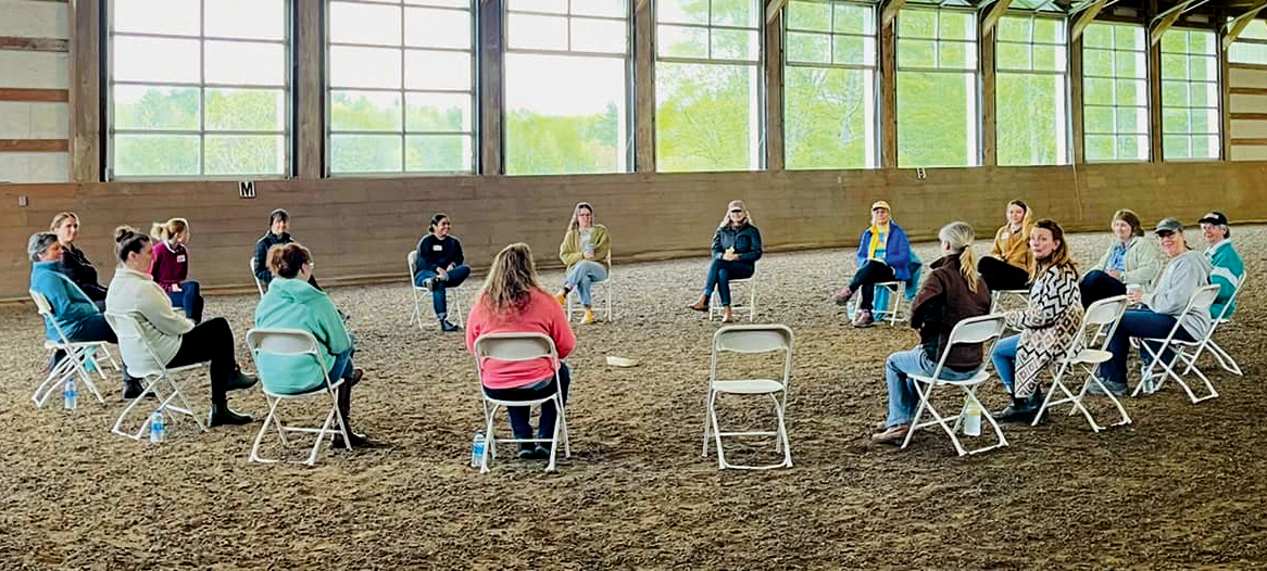 people sitting in circle at a retreat